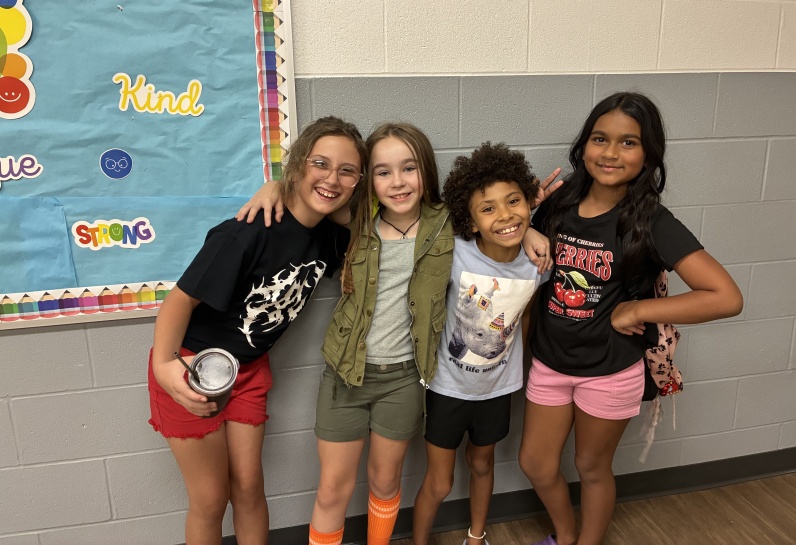 four kids smiling