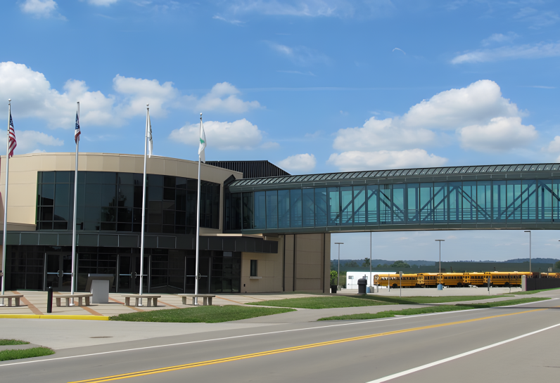 bridge over road going into building